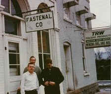Fastenal founders Bob Kierlin, Jack Remick and Van McConnon stand outside the first Fastenal store. Courtesy Fastenal