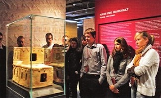 Trainees from Adolf Würth GmbH & Co. KG view a model house of the 3rd millennium B.C. The first exhibition of the Bronze Age town of Qatna excavations outside of Syria was sponsored by Würth.
